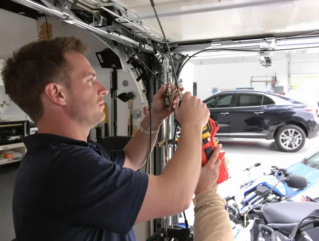 Burrillville Garage Door Repair safety certified technician performing cable replacement in Burrillville