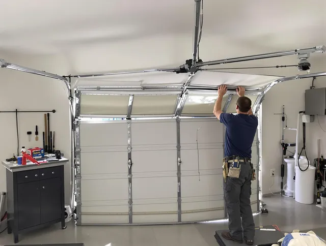 Burrillville Garage Door Repair specialist performing precise section replacement on Burrillville garage door