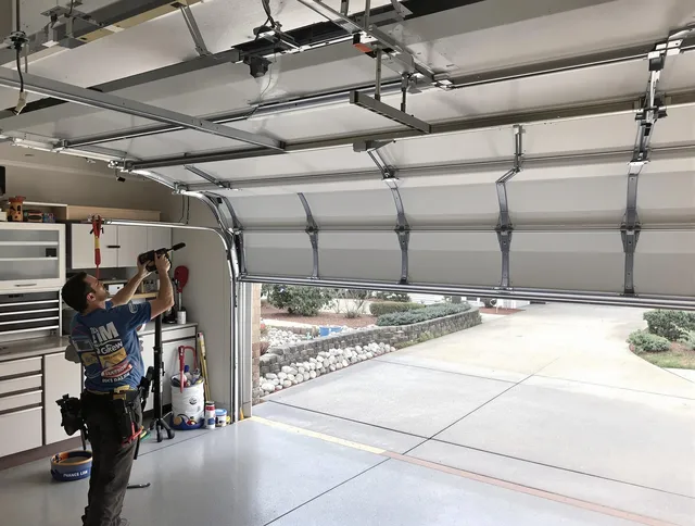 Garage door track repair service by Burrillville Garage Door Repair in Burrillville